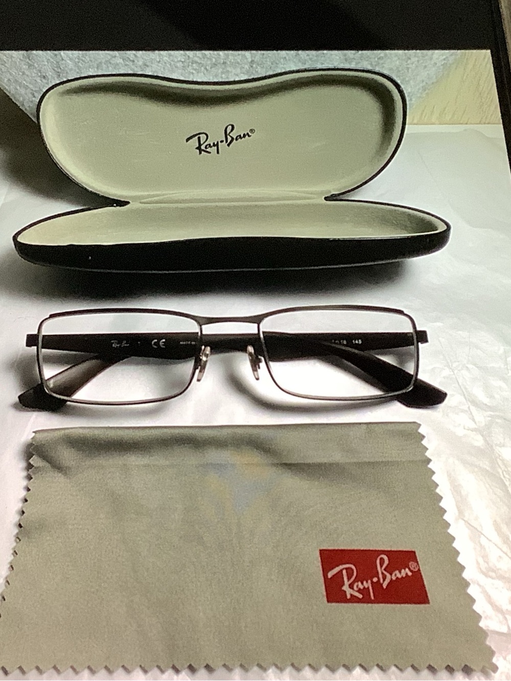 Ray-Ban RB6332 rectangular metal frames.